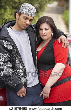 Young Couple Standing Next To Car View Large Photo Image Stock Photo - Young Couple Standing Next To Car. Fotosearch
