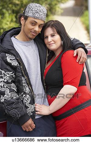 Young Couple Standing Next To Car View Large Photo Image Stock Photograph - Young Couple Standing Next To Car. Fotosearch