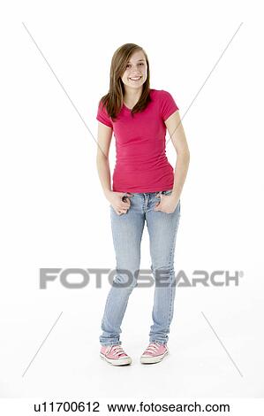 Stock Image - Young Girl Standing In Studio. Fotosearch