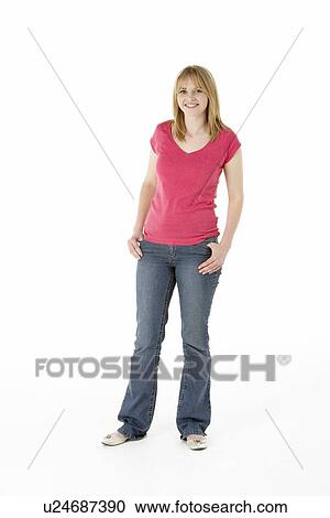 Stock Image - Young Girl Standing In Studio. Fotosearch