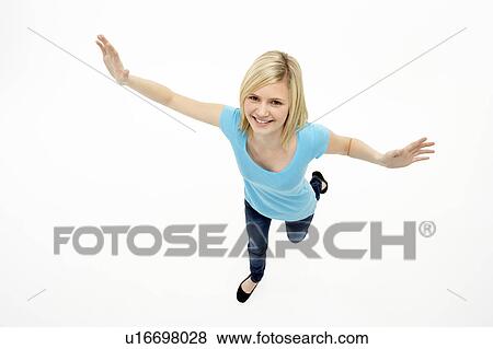 Young Girl Standing In Studio View Large Photo Image Stock Photo - Young Girl Standing In Studio. Fotosearch