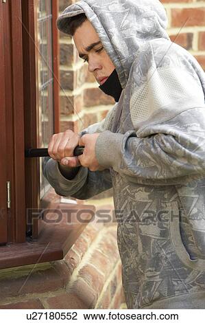 Young Man Breaking Into House View Large Photo Image Stock Image - Young Man Breaking Into House. Fotosearch