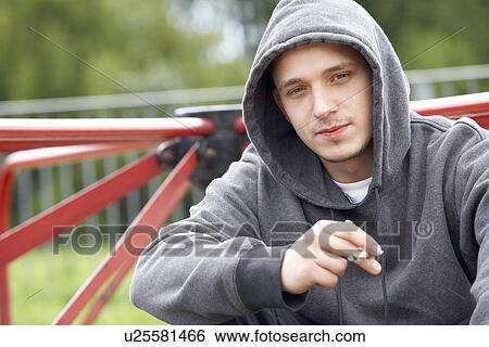 Young Man Sitting In Playground Smoking Joint View Large Photo Image Stock Photograph - Young Man Sitting In Playground Smoking Joint. Fotosearch