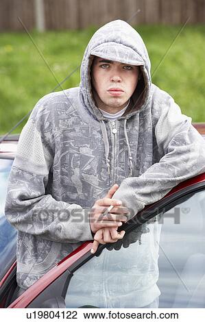 Young Man Standing Next To Car View Large Photo Image Stock Image - Young Man Standing Next To Car. Fotosearch