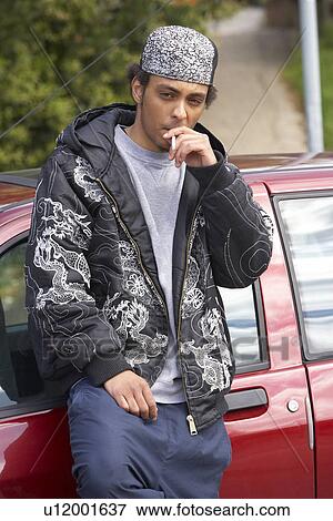 Young Man Standing Next To Car View Large Photo Image Stock Photo - Young Man Standing Next To Car. Fotosearch