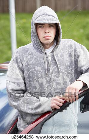 Young Man Standing Next To Car View Large Photo Image Stock Photo - Young Man Standing Next To Car. Fotosearch