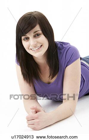 Stock Image - Young Woman Laying On Stomach. Fotosearch