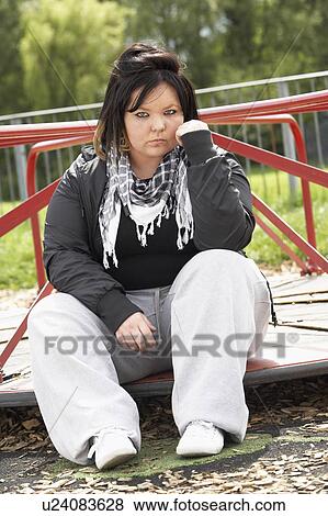 Young Woman Sitting In Playground View Large Photo Image Stock Photo - Young Woman Sitting In Playground. Fotosearch