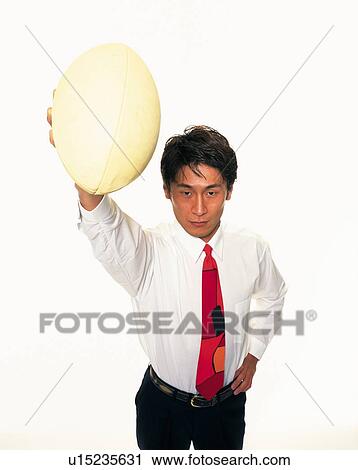 ビジネスマン ラグビーボールを持つ 空中高く 高い 角度 眺め ストックイメージ U Fotosearch