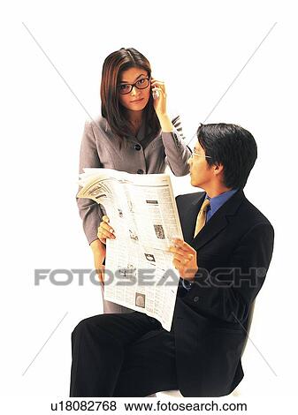 Stock Photo - Businessman and businesswoman communicating, Front View. Fotosearch