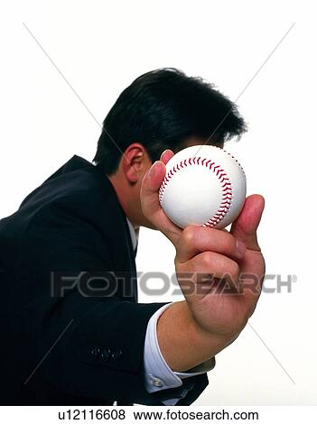 Businessman holding a baseball, Side View View Large Photo Image Stock Photo - Businessman holding a baseball, Side View. Fotosearch