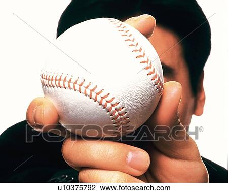 Businessman holding and raising a baseball, High Angle View, Close Up View Large Photo Image Stock Image - Businessman holding and raising a baseball, High Angle View, Close Up. Fotosearch
