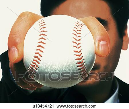 Businessman holding and raising a baseball, High Angle View, Close Up View Large Photo Image Stock Image - Businessman holding and raising a baseball, High Angle View, Close Up. Fotosearch
