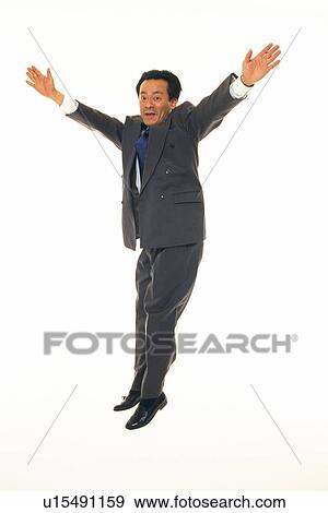 Businessman jumping and stretching out arms, Front View View Large Photo Image Stock Photo - Businessman jumping and stretching out arms, Front View. Fotosearch