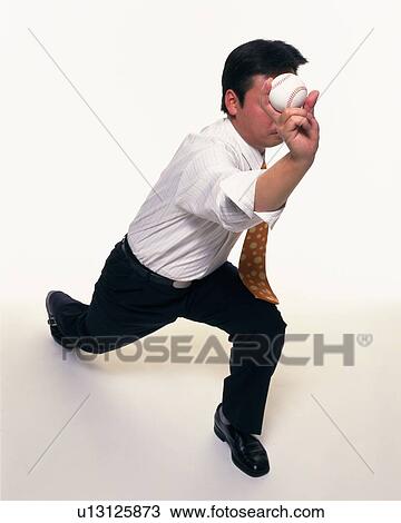 Businessman pitching a baseball, High Angle View View Large Photo Image Stock Image - Businessman pitching a baseball, High Angle View. Fotosearch