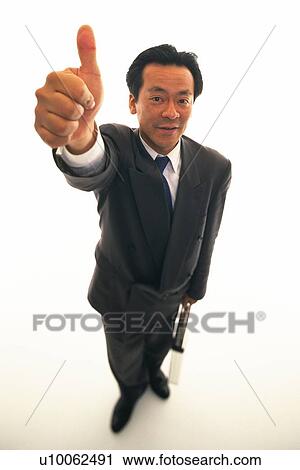 Businessman putting thumb up in the air with smile, High Angle View View Large Photo Image Stock Image - Businessman putting thumb up in the air with smile, High Angle View. Fotosearch
