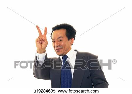 Businessman putting V sign up in the air with smile, Front View View Large Photo Image Stock Photography - Businessman putting V sign up in the air with smile, Front View. Fotosearch