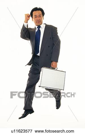 Businessman with fist up in the air, Front View View Large Photo Image Stock Photo - Businessman with fist up in the air, Front View. Fotosearch