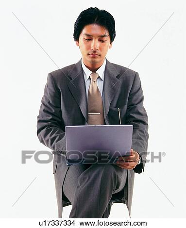 Picture - Businessman working with laptop computer, Front View. Fotosearch