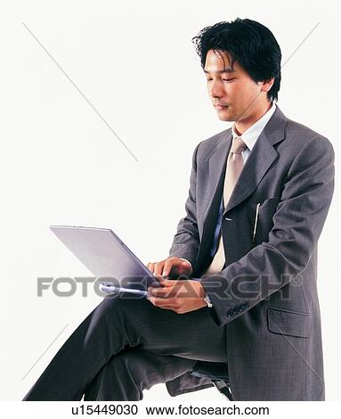 Businessman working with laptop computer, Side View View Large Photo Image Stock Image - Businessman working with laptop computer, Side View. Fotosearch