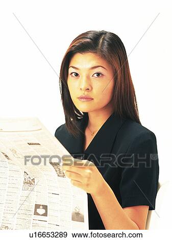 Businesswoman looking at camera and holding news paper, Front View View Large Photo Image Stock Photo - Businesswoman looking at camera and holding news paper, Front View. Fotosearch