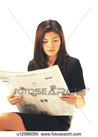 Businesswoman sitting and reading news paper, Front View View Large Photo Image Stock Photography - Businesswoman sitting and reading news paper, Front View. Fotosearch