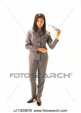 Businesswoman standing and taking glasses off, Front View View Large Photo Image Stock Photo - Businesswoman standing and taking glasses off, Front View. Fotosearch