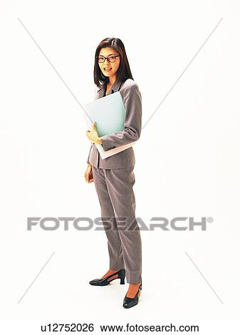 Businesswoman standing with documents, Side View View Large Photo Image Stock Photograph - Businesswoman standing with documents, Side View. Fotosearch