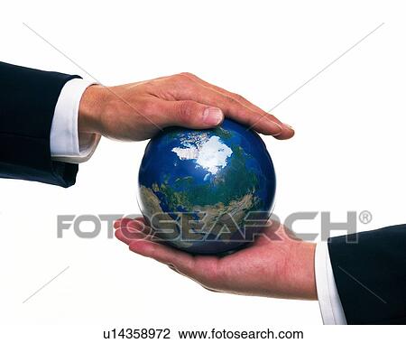 Stock Image - Close up shot of two hands holding globe from top and bottom, Side View. Fotosearch
