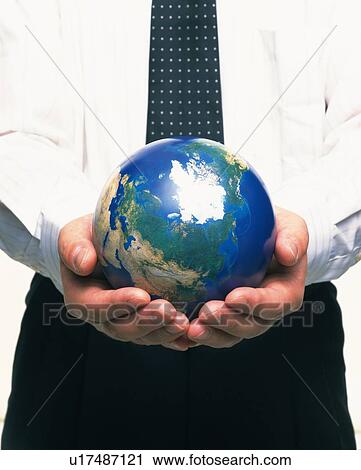 Stock Image - Hands holding globe, Front View. Fotosearch