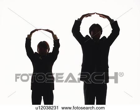 Bsinessman and businesswoman making circle above heads with hands, Front View, Silhouette View Large Photo Image Stock Image - Bsinessman and businesswoman making circle above heads with hands, Front View, Silhouette . Fotosearch