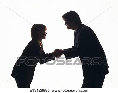Bsinessman and businesswoman smiling and shaking hands, Side View, Silhouette View Large Photo Image Stock Photography - Bsinessman and businesswoman smiling and shaking hands, Side View, Silhouette . Fotosearch