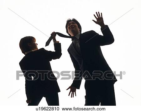 Stock Image - Bsinessman being beaten by businesswoman, Silhouette . Fotosearch