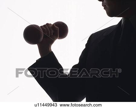 Stock Image - Bsinessman exercising with a dumbbell, Front View, Silhouette . Fotosearch