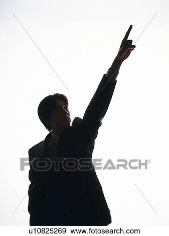 Stock Photo - Bsinessman looking and pointing up, Front View, Silhouette . Fotosearch