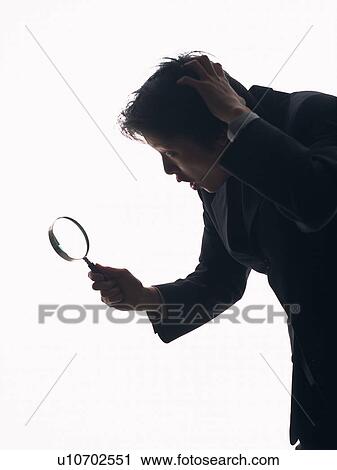 Bsinessman looking at something with a magnifying glass, Side View, Silhouette View Large Photo Image Stock Image - Bsinessman looking at something with a magnifying glass, Side View, Silhouette . Fotosearch