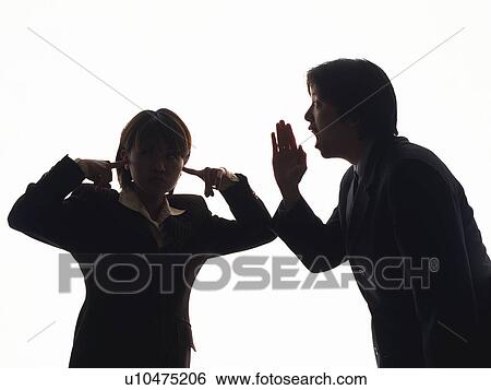 Stock Photograph - Bsinessman shouting and businesswoman blocking ears, Front View, Silhouette . Fotosearch