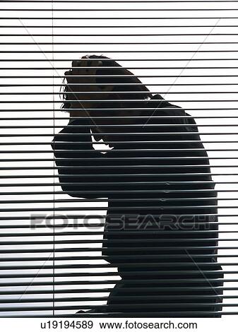 Stock Photo - Bsinessman sitting and troubled by the blind, Side View, Silhouette . Fotosearch