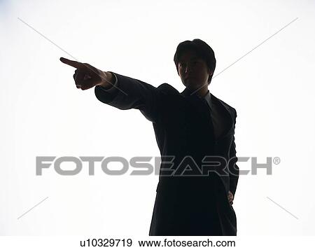 Stock Photo - Bsinessman standing with pointing finger, Front View, Silhouette . Fotosearch