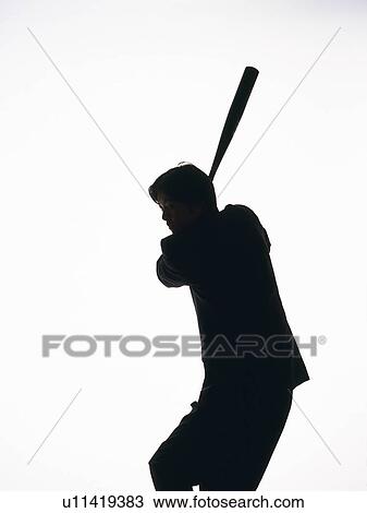 Stock Image - Bsinessman swinging a bat, Side View, Silhouette . Fotosearch