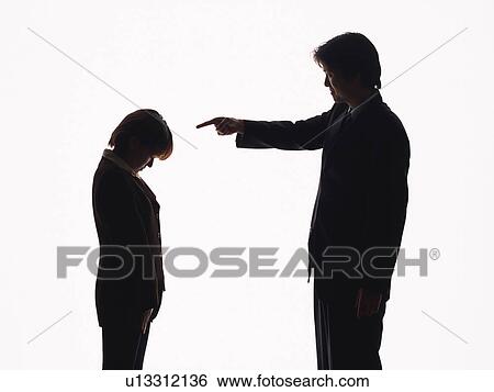 Stock Photograph - Bsinessman yelling at businesswoman, Silhouette . Fotosearch