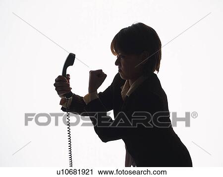 Bsinesswoman holding and yelling at handset, Side View, Silhouette View Large Photo Image Stock Image - Bsinesswoman holding and yelling at handset, Side View, Silhouette . Fotosearch