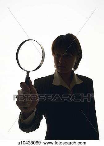 Bsinesswoman looking at something through magnifying glass, Front View, Silhouette View Large Photo Image Stock Photo - Bsinesswoman looking at something through magnifying glass, Front View, Silhouette . Fotosearch