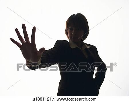 Stock Photo - Bsinesswoman raising palm foreword, Front View, Silhouette . Fotosearch