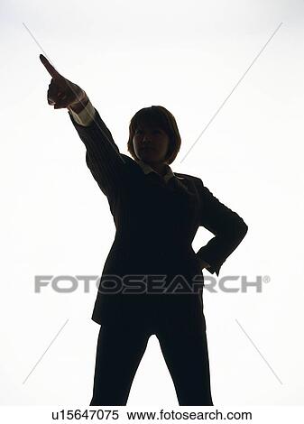 Stock Photography - Bsinesswoman standing and pointing away, Front View, Silhouette . Fotosearch