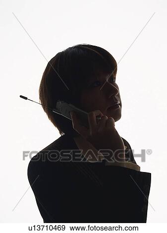 Bsinesswoman using mobile phone, Side View, Silhouette View Large Photo Image Stock Photo - Bsinesswoman using mobile phone, Side View, Silhouette . Fotosearch