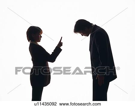 Stock Image - Bsinesswoman yelling at businessman, Silhouette . Fotosearch
