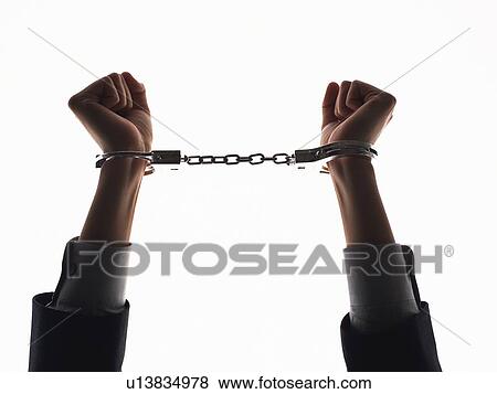 Stock Photo - Hands in handcuffs, Silhouette. Fotosearch