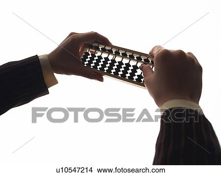 Picture - Hands using abacus, High Angle View, Silhouette. Fotosearch