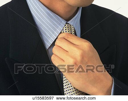 Businessman adjusting tie, Portrait, Close Up View Large Photo Image Stock Photo - Businessman adjusting tie, Portrait, Close Up. Fotosearch